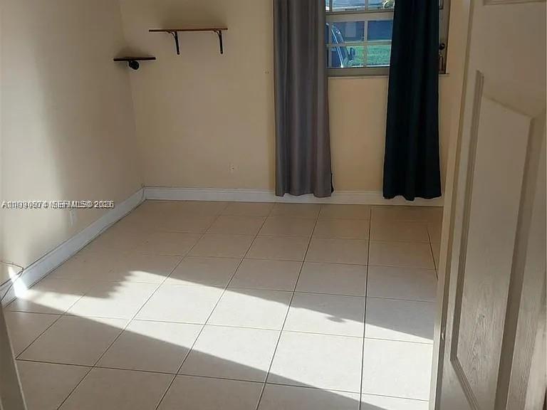 6117 Southwest 31st Street, Unit B Miramar, FL 33023 - Photo 5 of 8 a view of a closet