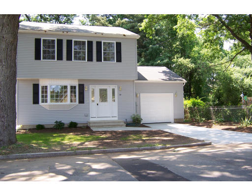 94 Lamont Street Springfield, MA 01119 - Photo 3 of 14 a view of a house with a patio and a yard