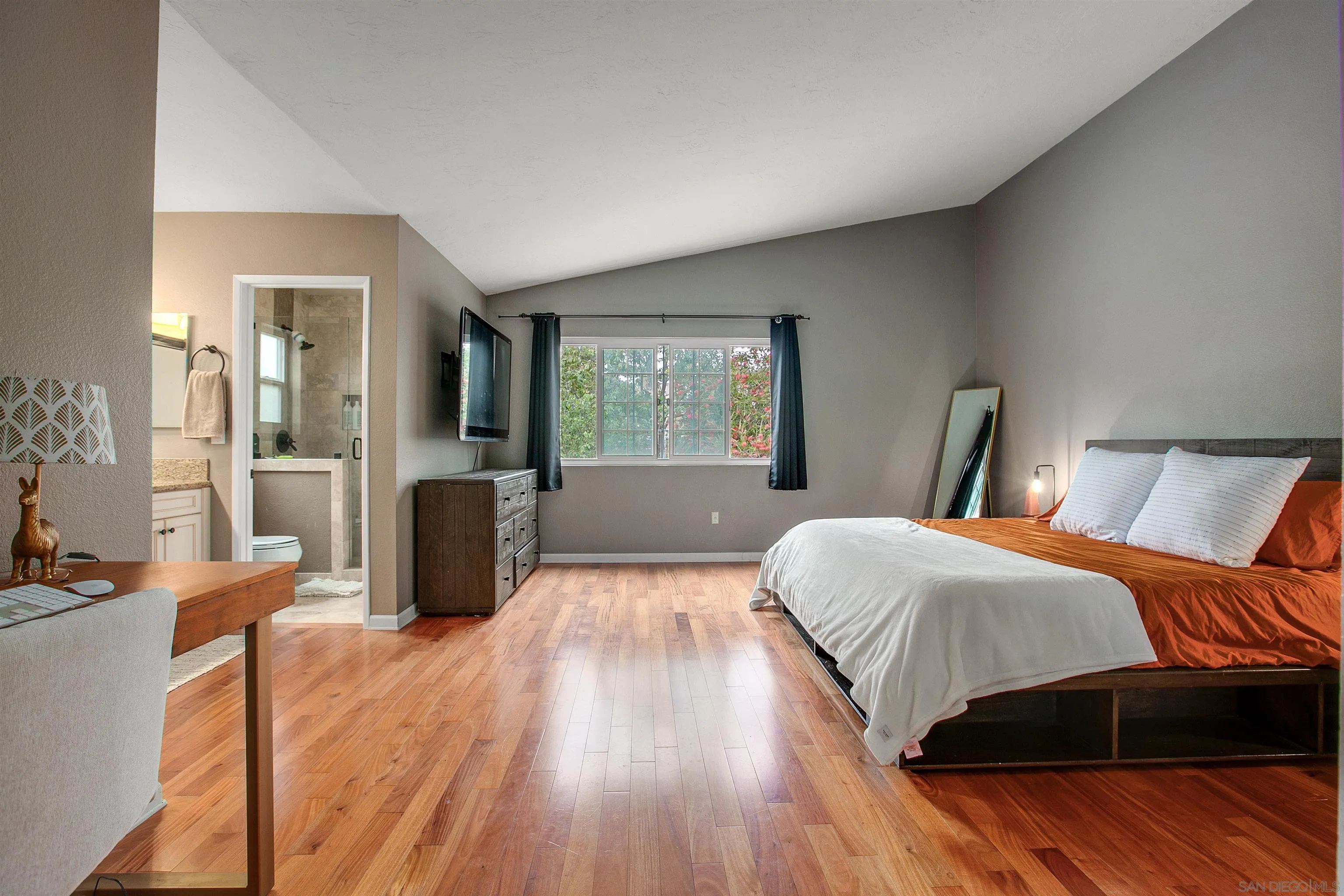2952 Cape Cod Circle Carlsbad, CA 92010 - Photo 12 of 24 a bedroom with a bed and wooden floor