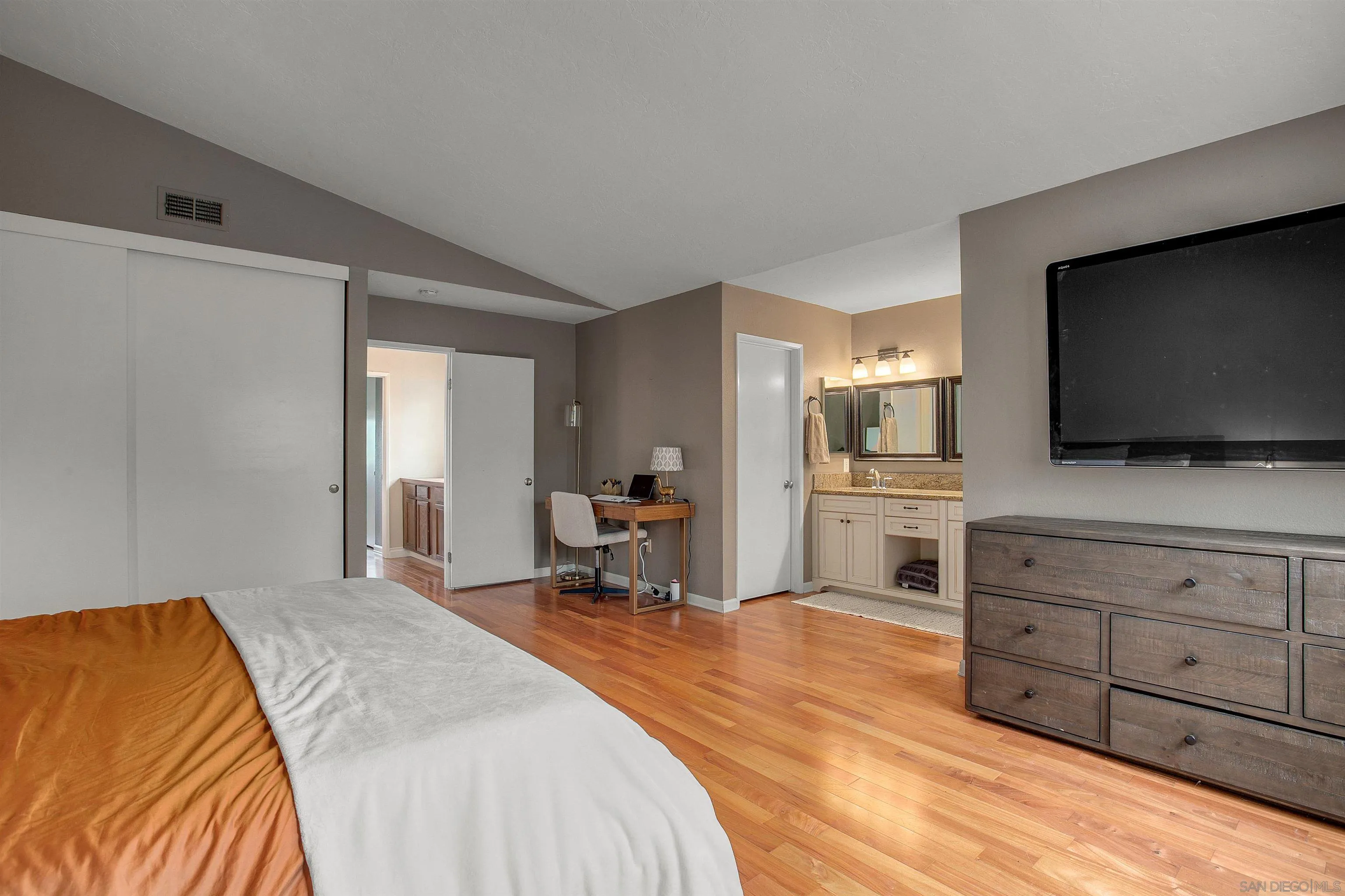 2952 Cape Cod Circle Carlsbad, CA 92010 - Photo 14 of 24 a spacious bedroom with a bed and flat screen tv