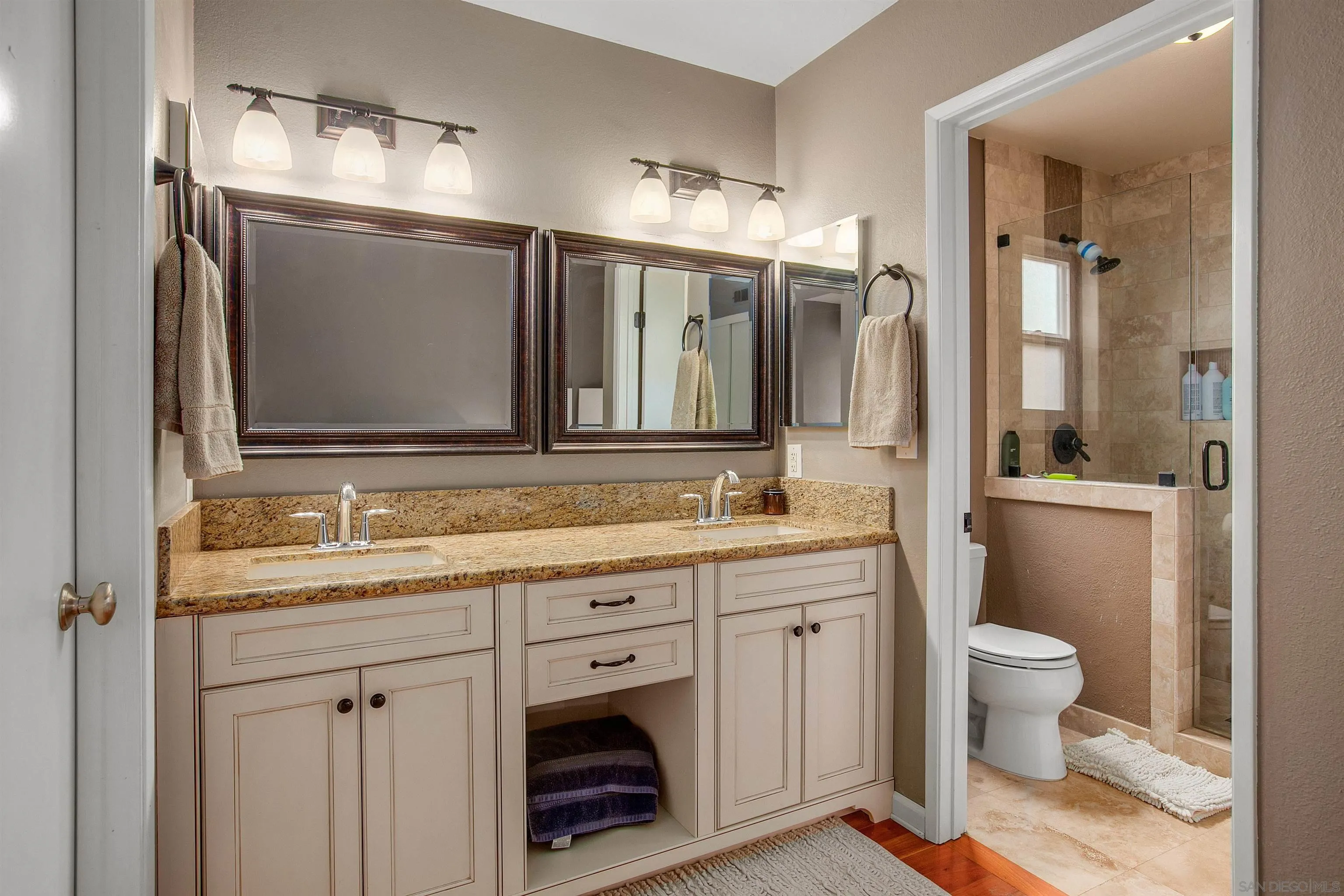 2952 Cape Cod Circle Carlsbad, CA 92010 - Photo 15 of 24 a bathroom with a granite countertop sink vanity mirror and toilet