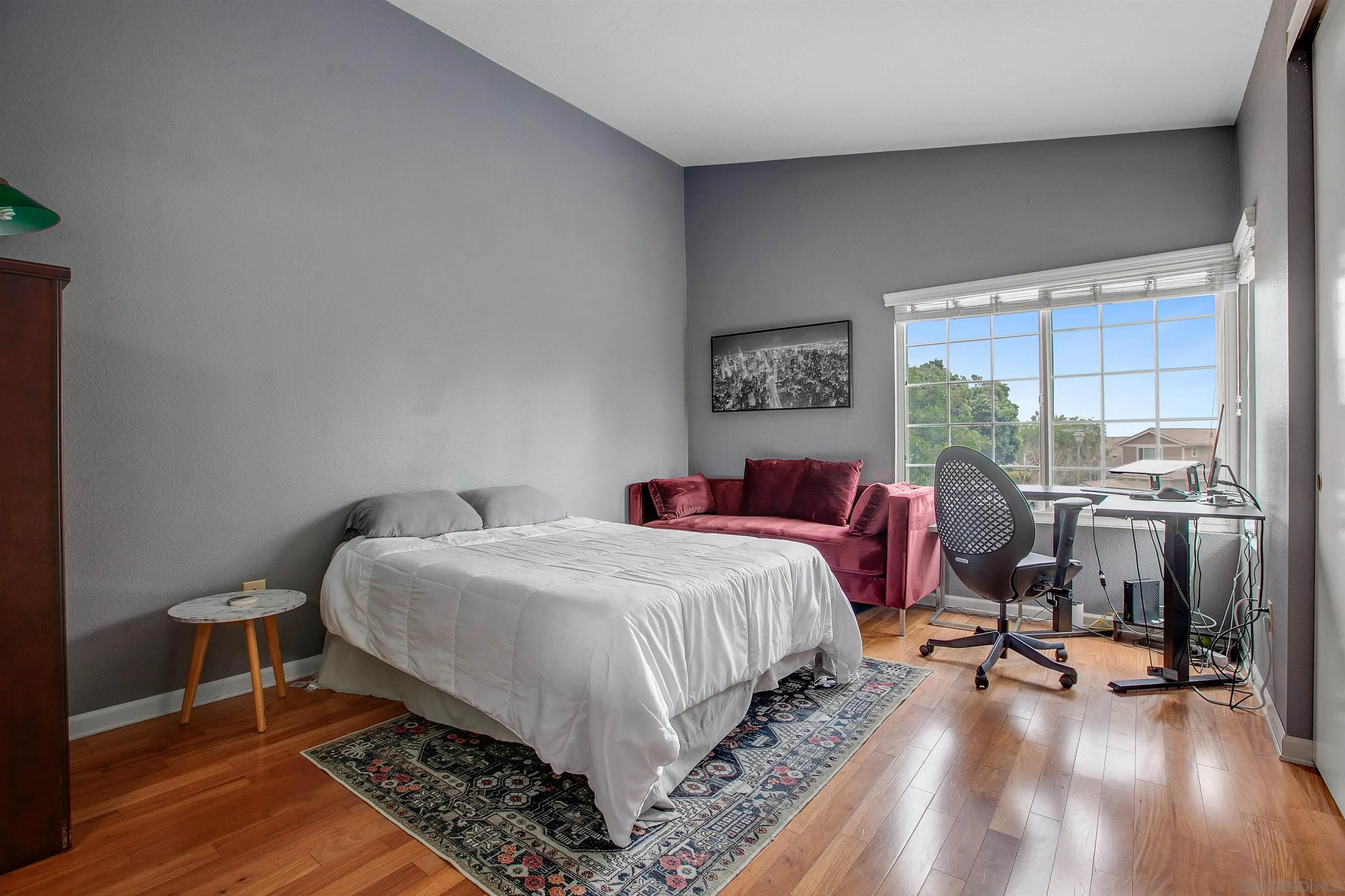2952 Cape Cod Circle Carlsbad, CA 92010 - Photo 18 of 24 a bedroom with a bed and wooden floor
