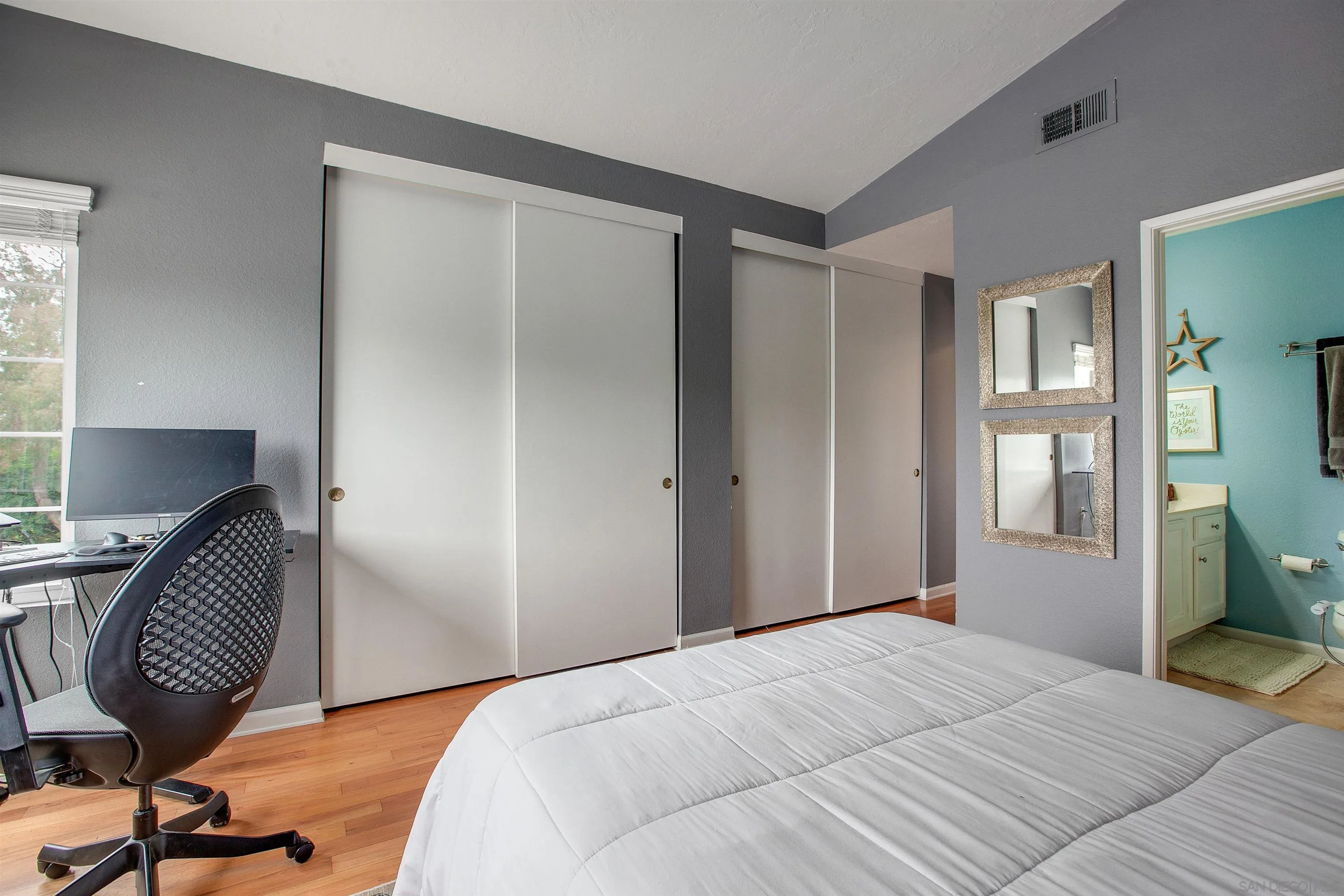 2952 Cape Cod Circle Carlsbad, CA 92010 - Photo 19 of 24 a bedroom with a bed and chair