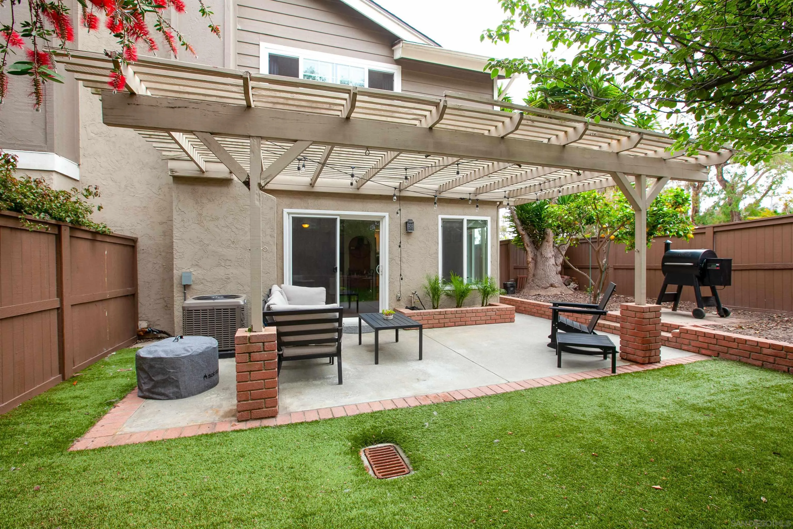 2952 Cape Cod Circle Carlsbad, CA 92010 - Photo 23 of 24 a view of a house with backyard sitting area and garden