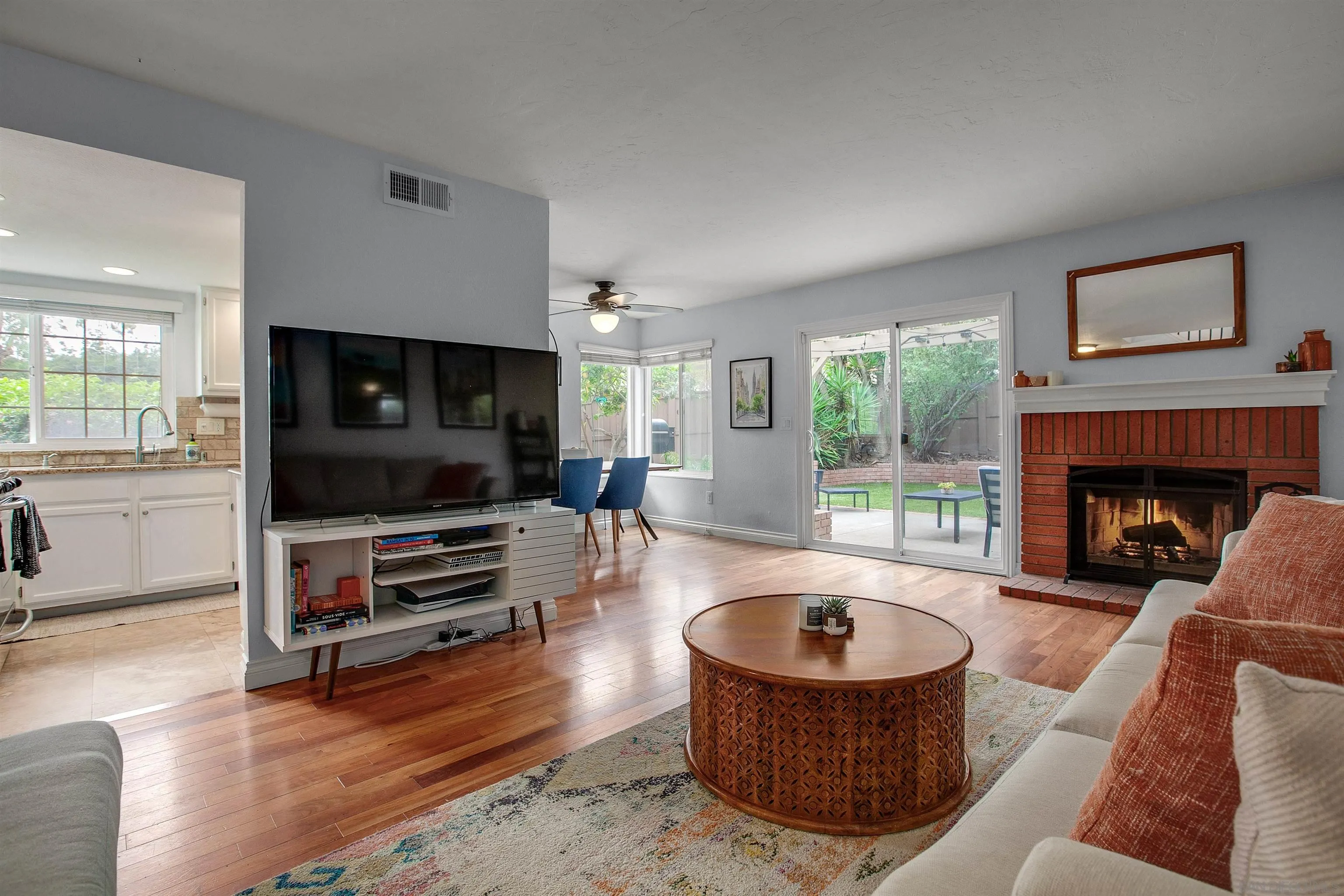 2952 Cape Cod Circle Carlsbad, CA 92010 - Photo 4 of 24 a living room with furniture and a fireplace