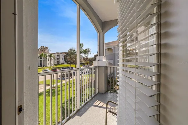 a view of a patio with couches and a table and chairs