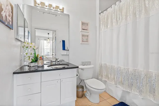 a view of a bathroom from a hallway