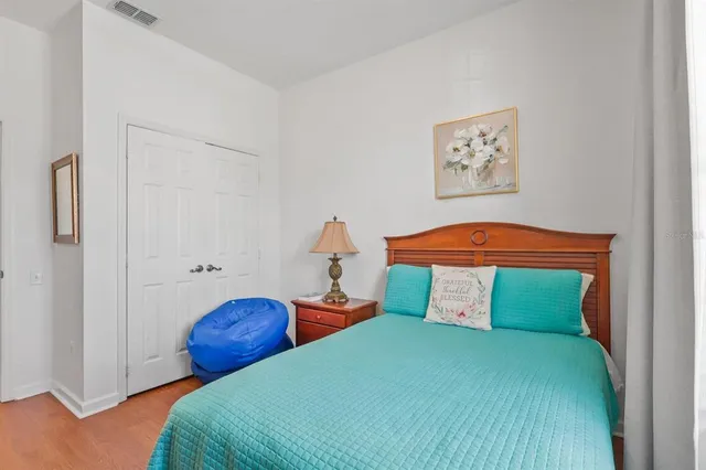 a bathroom with a sink a potted plant and a mirror