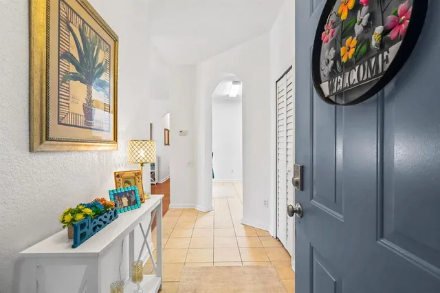 a living room with furniture and a dining table with garden view