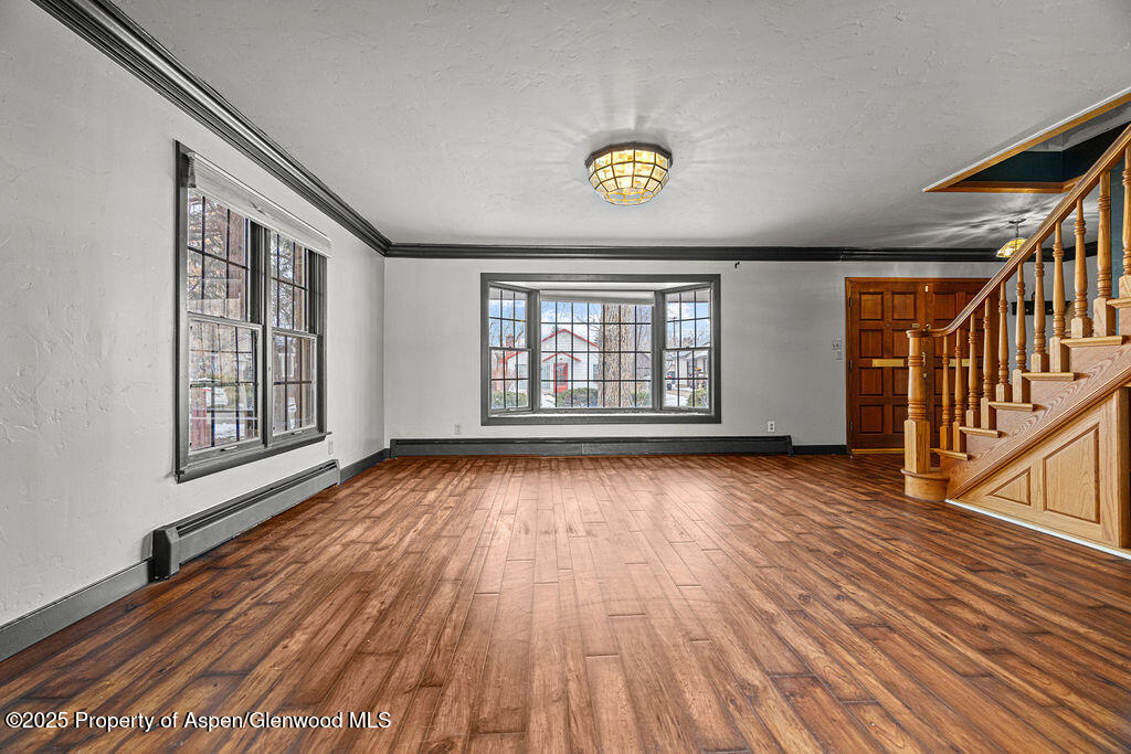 779 Taylor Street Craig, CO 81625 - Photo 20 of 84 wooden floor in an empty room with a window
