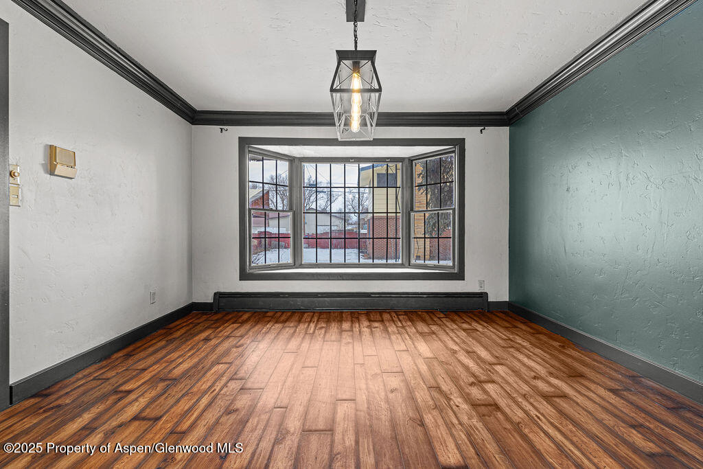 779 Taylor Street Craig, CO 81625 - Photo 33 of 84 a view of empty room with wooden floor and fan