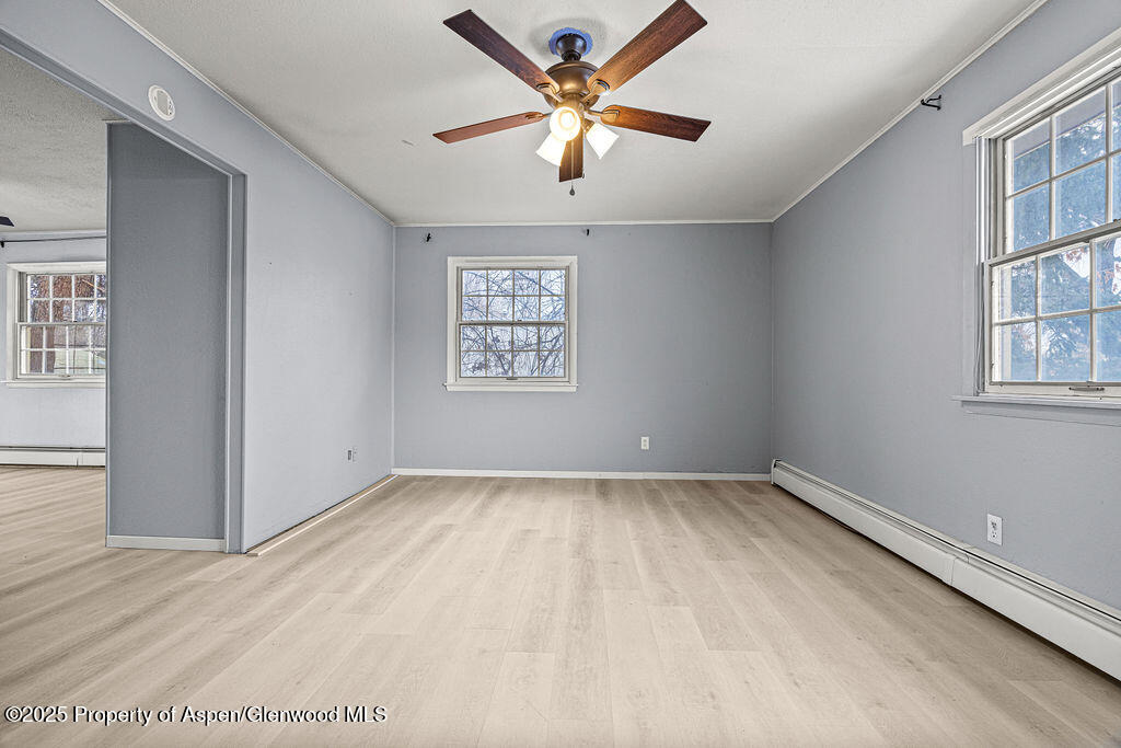779 Taylor Street Craig, CO 81625 - Photo 45 of 84 an empty room with windows and fan