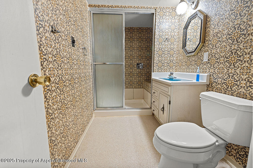 779 Taylor Street Craig, CO 81625 - Photo 56 of 84 a bathroom with a toilet and a shower