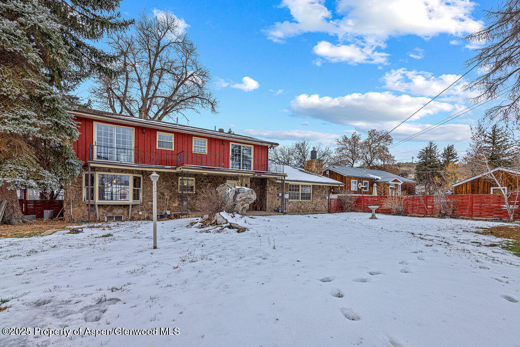 779 Taylor Street Craig, CO 81625 - Photo 6 of 84 a view of a house with a snow in a yard