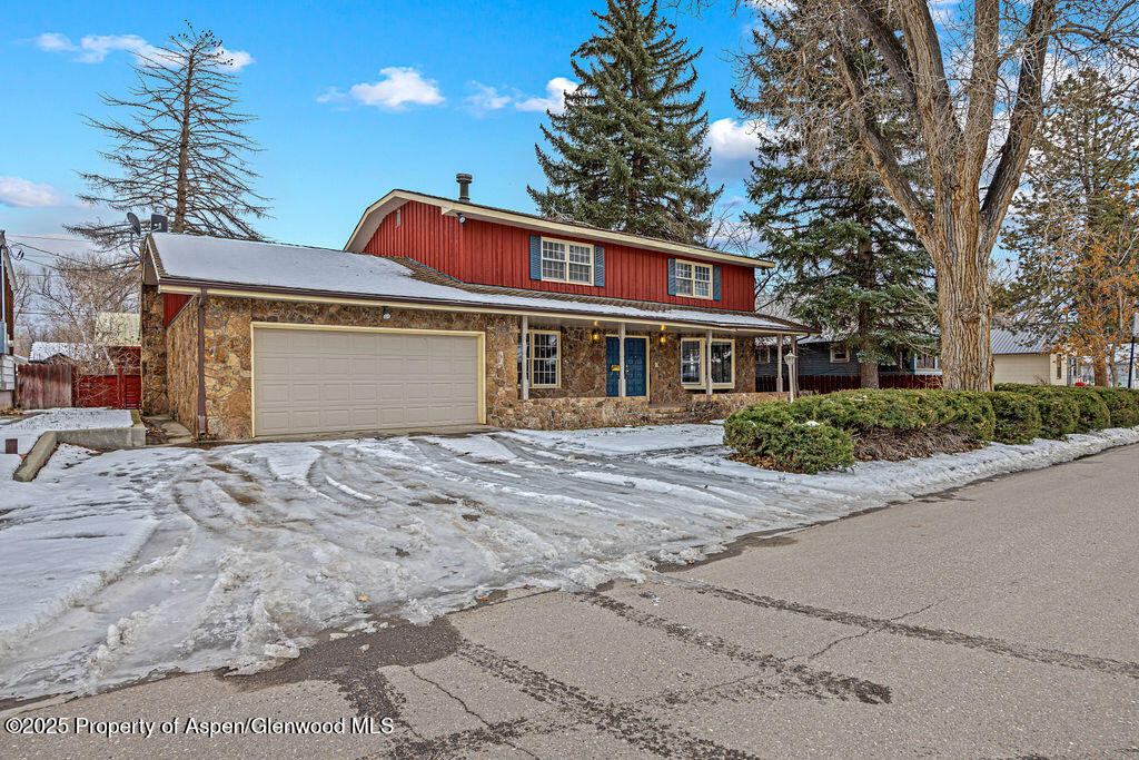 779 Taylor Street Craig, CO 81625 - Photo 73 of 84 a front view of a house with a yard and garage