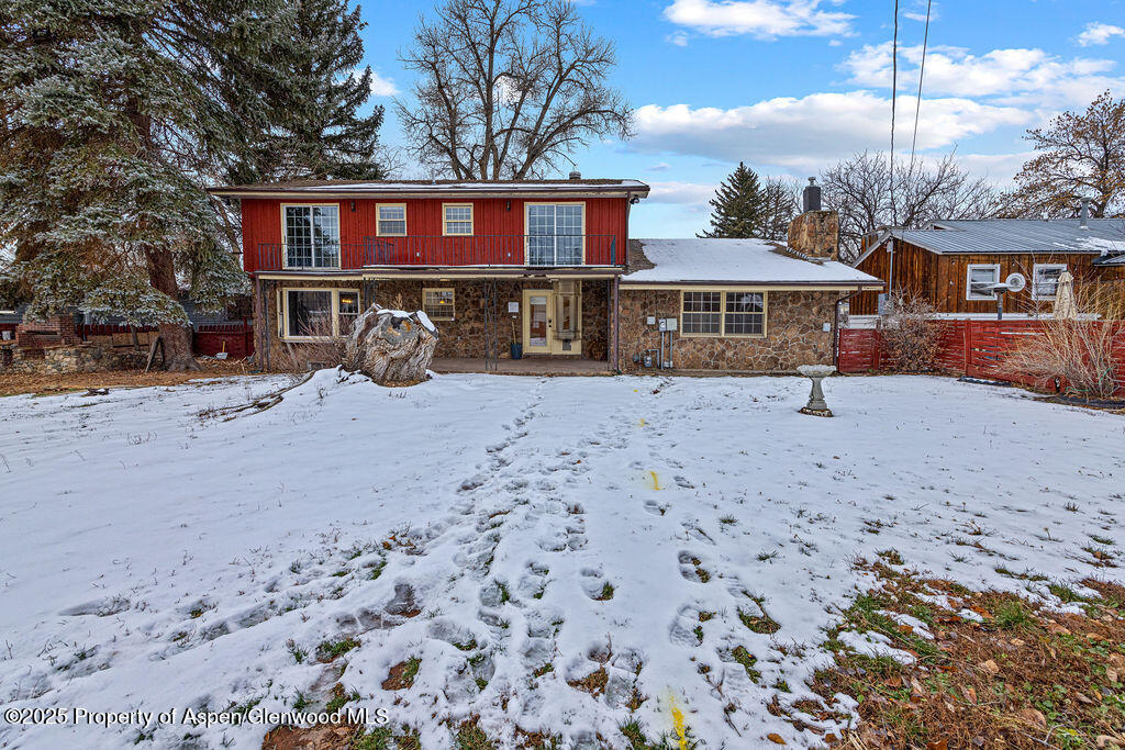 779 Taylor Street Craig, CO 81625 - Photo 79 of 84 a front view of a house with a yard and garage