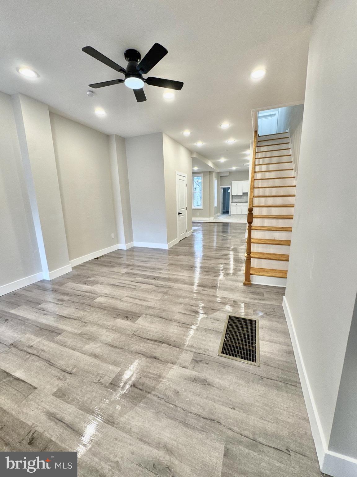 5151 Wyalusing Avenue Philadelphia, PA 19131 - Photo 2 of 9 a view of an empty room with wooden floor and a ceiling fan