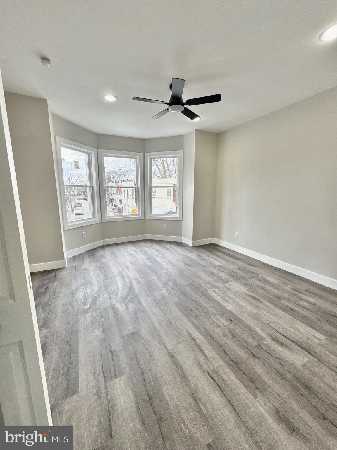 5151 Wyalusing Avenue Philadelphia, PA 19131 - Photo 8 of 9 a view of an empty room with a window and wooden floor