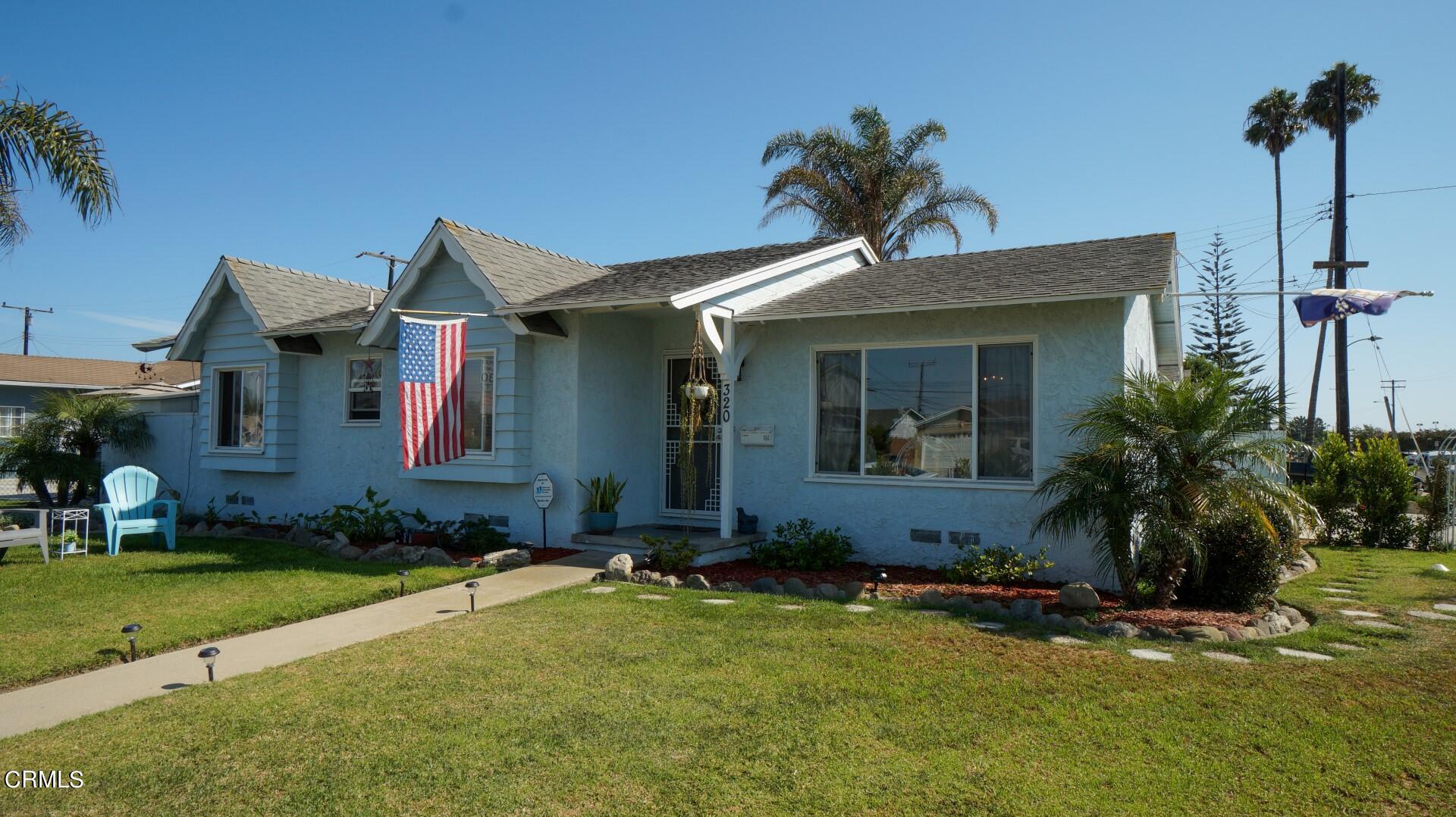 320 West Bard Road Oxnard, CA 93033 - Photo 1 of 21 a front view of a house with a yard