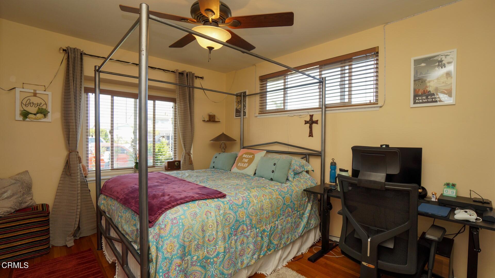 320 West Bard Road Oxnard, CA 93033 - Photo 13 of 21 a bedroom with a bed and windows
