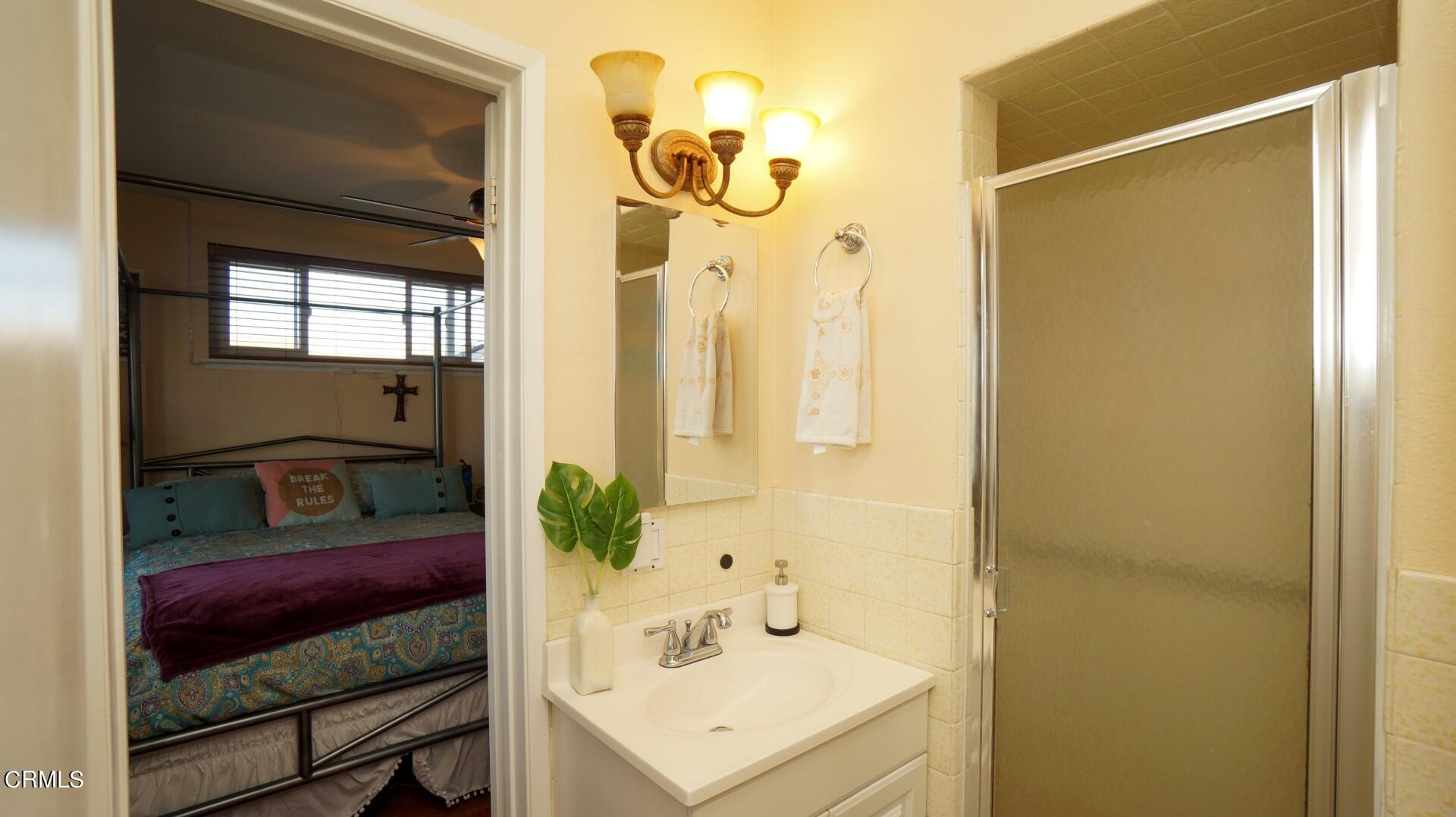 320 West Bard Road Oxnard, CA 93033 - Photo 14 of 21 a bathroom with a sink and a mirror