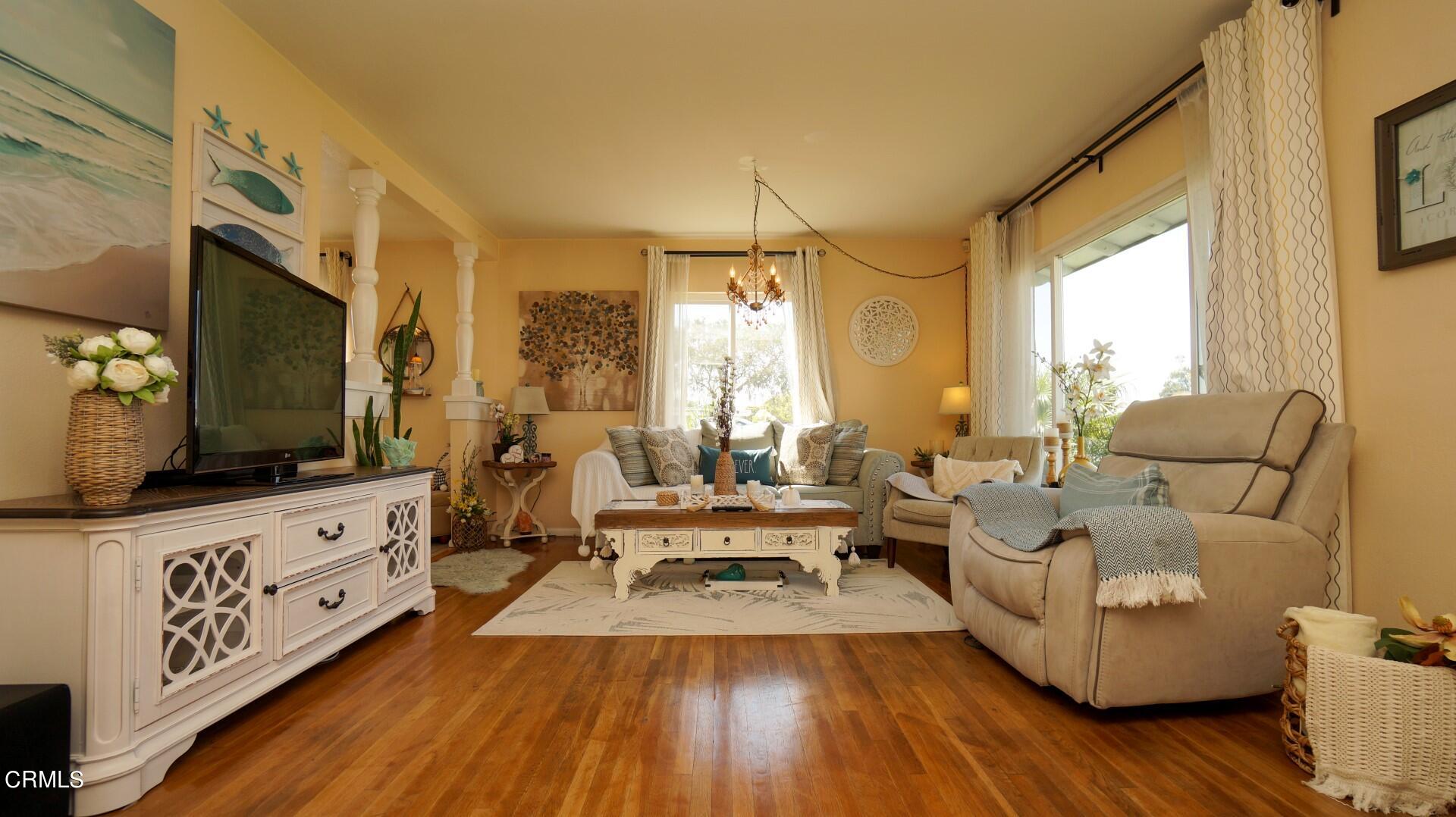 320 West Bard Road Oxnard, CA 93033 - Photo 4 of 21 a living room with furniture and a flat screen tv