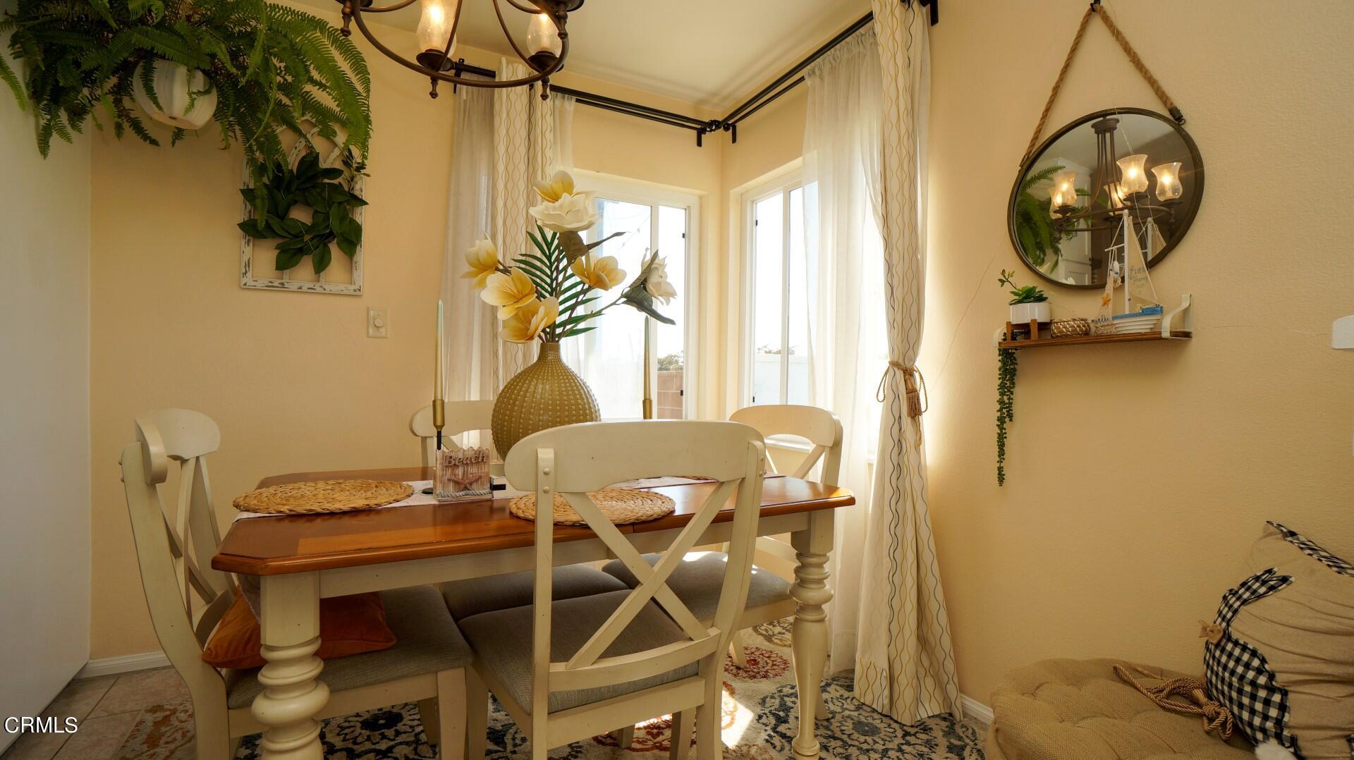 320 West Bard Road Oxnard, CA 93033 - Photo 7 of 21 a view of a room with a table and chairs