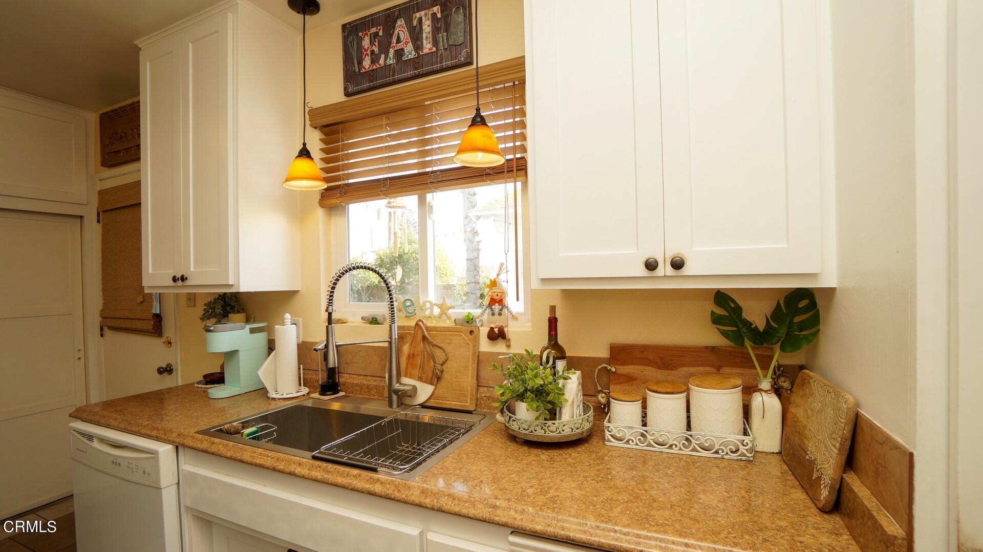 320 West Bard Road Oxnard, CA 93033 - Photo 9 of 21 a kitchen with a sink and a stove top oven