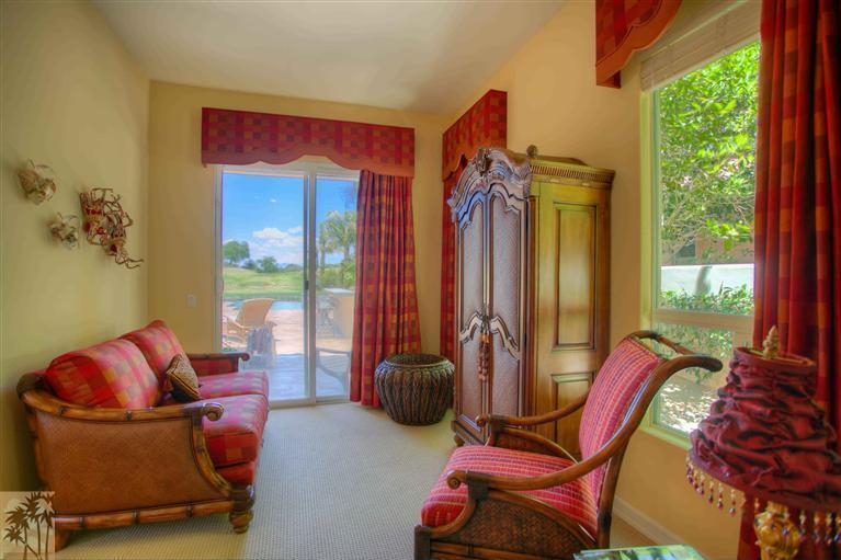 366 Loch Lomond Road Rancho Mirage, CA 92270 - Photo 14 of 25 a living room with furniture a rug and a window
