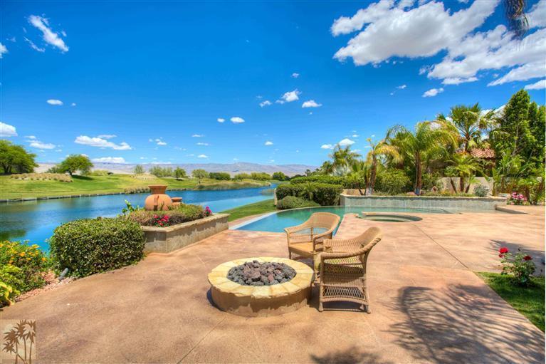 366 Loch Lomond Road Rancho Mirage, CA 92270 - Photo 22 of 25 a swimming pool with outdoor seating and yard