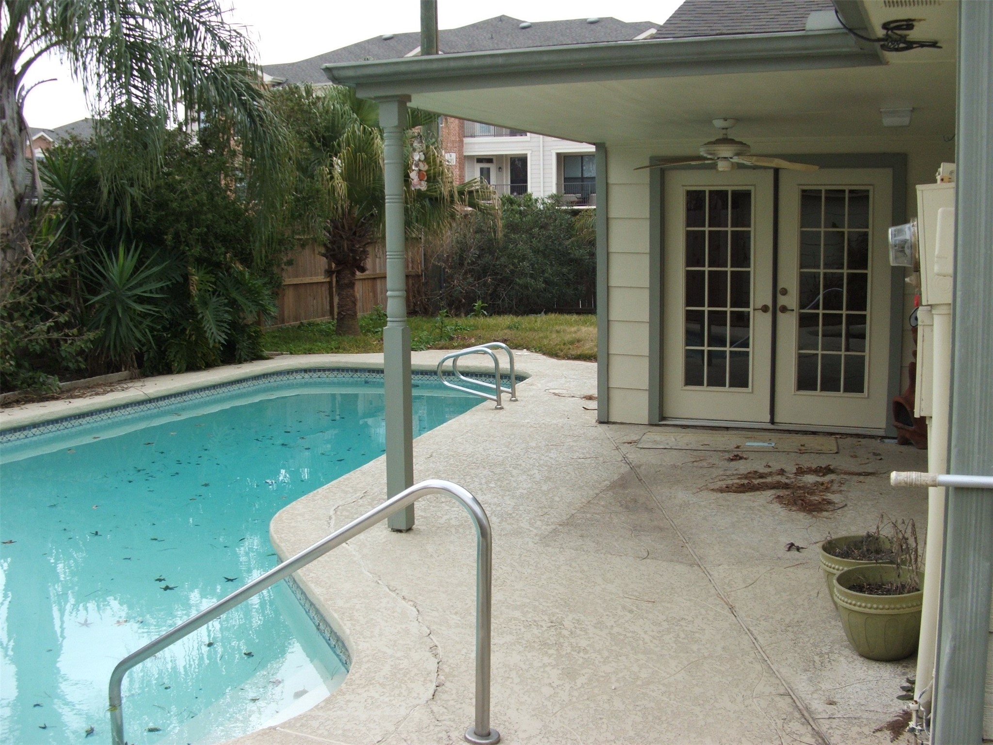 8231 Fernbrook Lane Houston, TX 77070 - Photo 9 of 12 a view of a balcony with a floor to ceiling window and garden