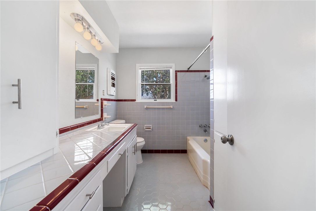 826 Rosedale Drive Corpus Christi, TX 78411 - Photo 13 of 22 a bathroom with a sink a toilet and tub