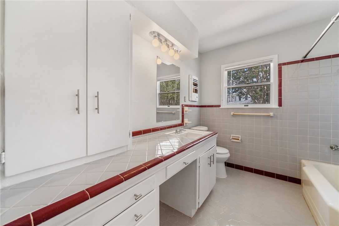 826 Rosedale Drive Corpus Christi, TX 78411 - Photo 14 of 22 a bathroom with a sink and a mirror