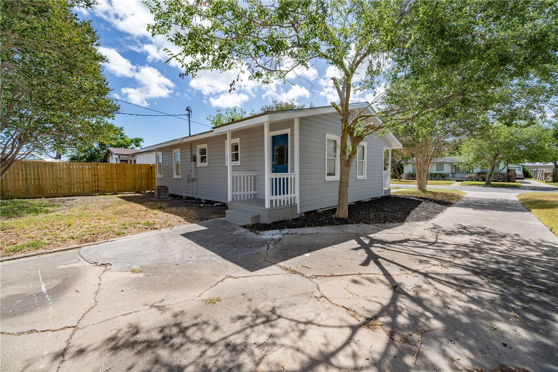 826 Rosedale Drive Corpus Christi, TX 78411 - Photo 18 of 22 a view of a white house with a yard covered in snow