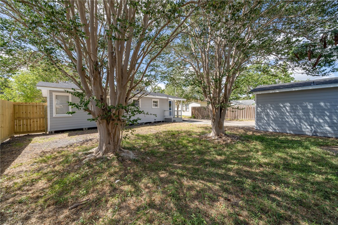 826 Rosedale Drive Corpus Christi, TX 78411 - Photo 20 of 22 a tree in front of a white house
