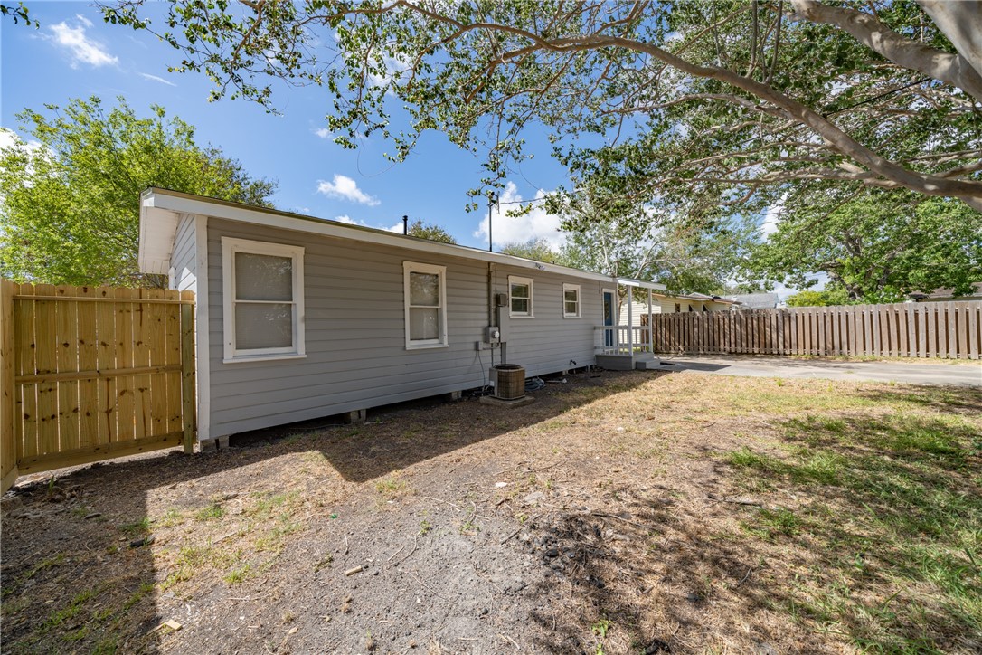 826 Rosedale Drive Corpus Christi, TX 78411 - Photo 21 of 22 a view of a house with a backyard and a large tree