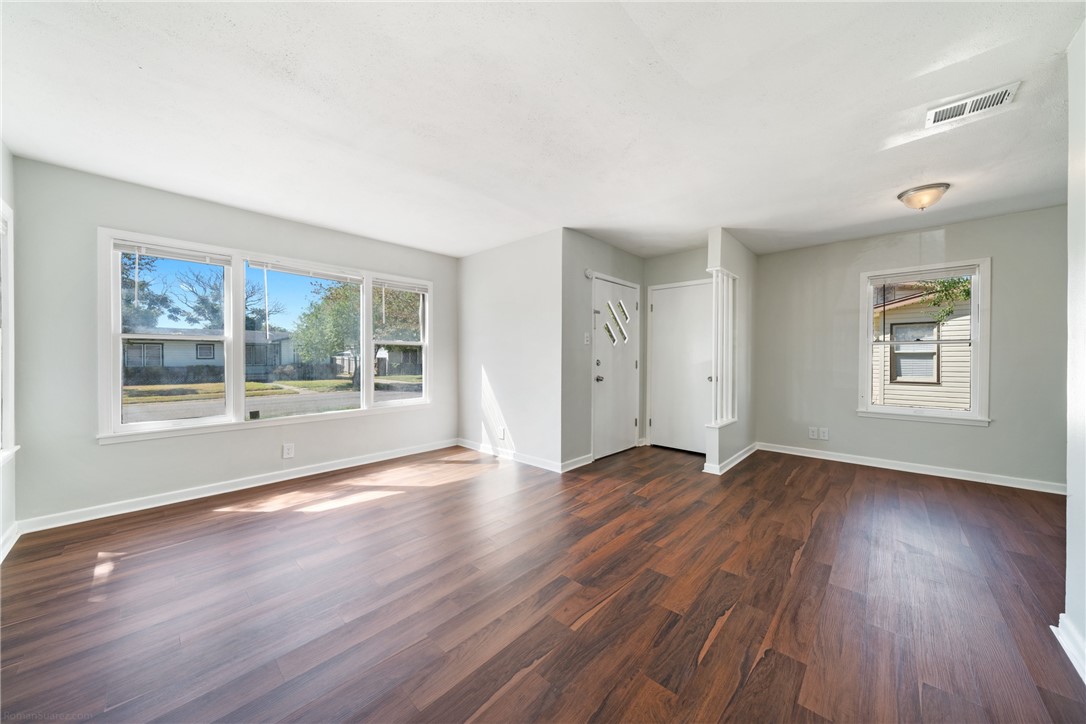826 Rosedale Drive Corpus Christi, TX 78411 - Photo 3 of 22 a view of empty room with wooden floor and fan