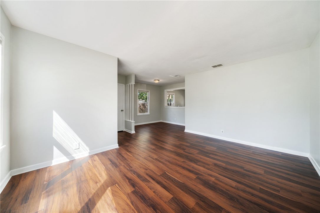 826 Rosedale Drive Corpus Christi, TX 78411 - Photo 4 of 22 a view of wooden floor and windows in a room