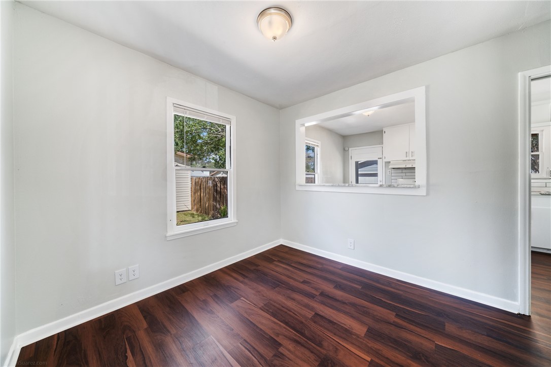826 Rosedale Drive Corpus Christi, TX 78411 - Photo 6 of 22 a view of room with hardwood floor and window