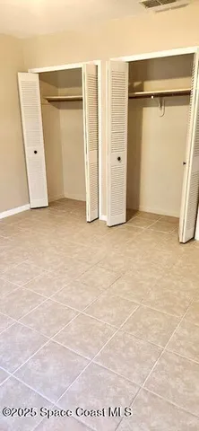 a view of an empty room with a bathroom