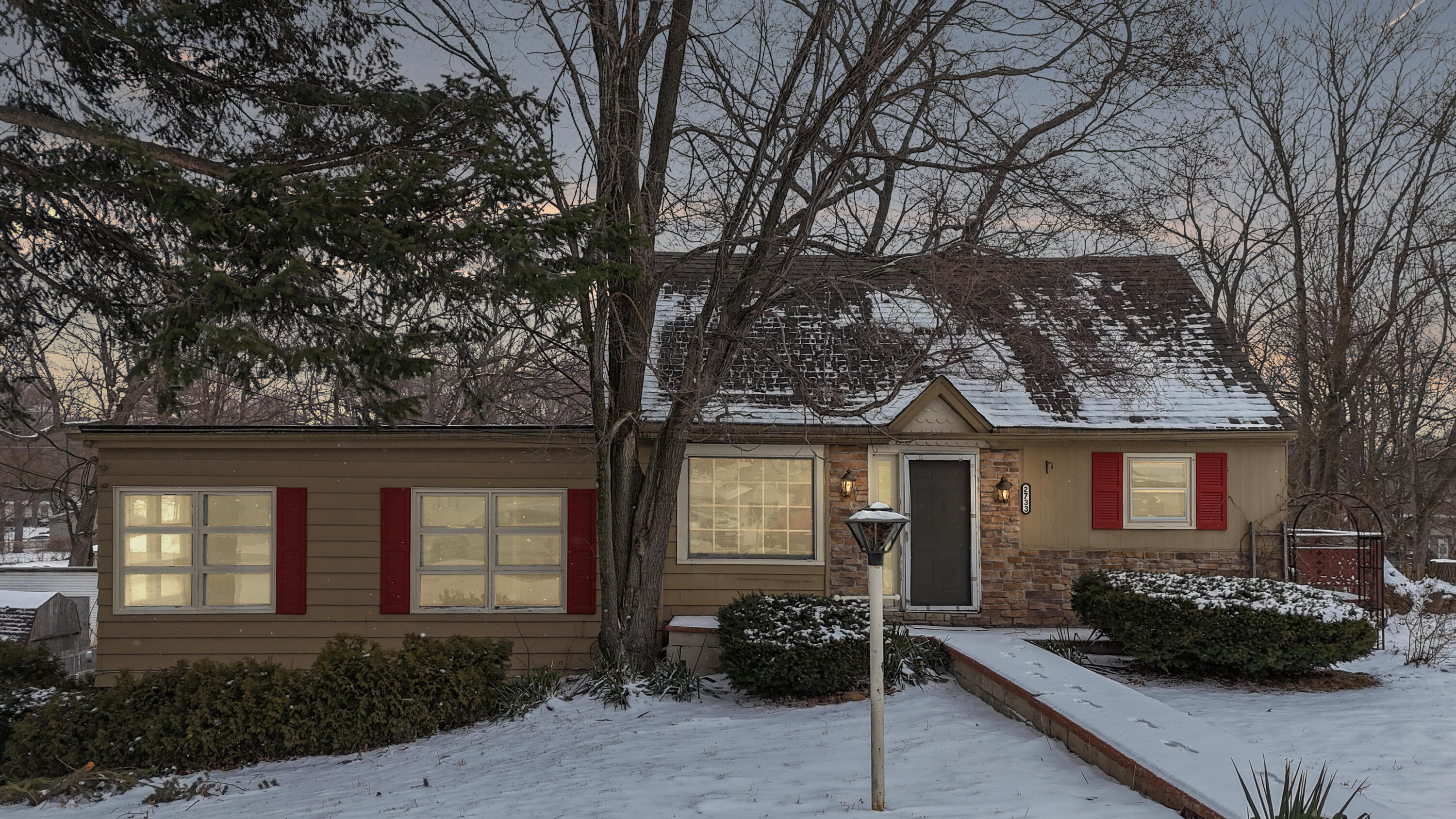 2733 Locust Street Portage, IN 46368 - Photo 1 of 20 a front view of a house with garden