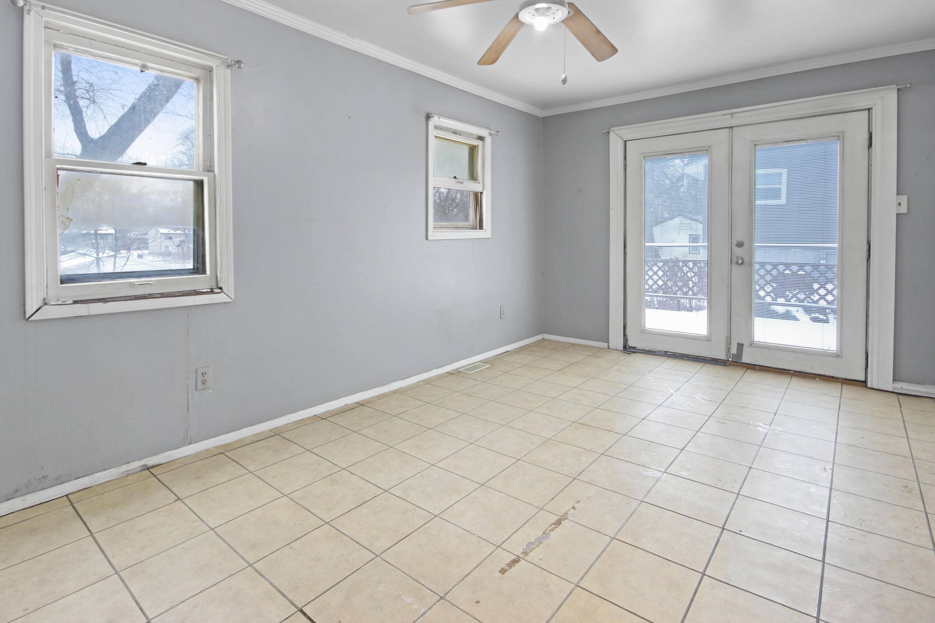 2733 Locust Street Portage, IN 46368 - Photo 9 of 20 a view of an empty room with a window and kitchen view