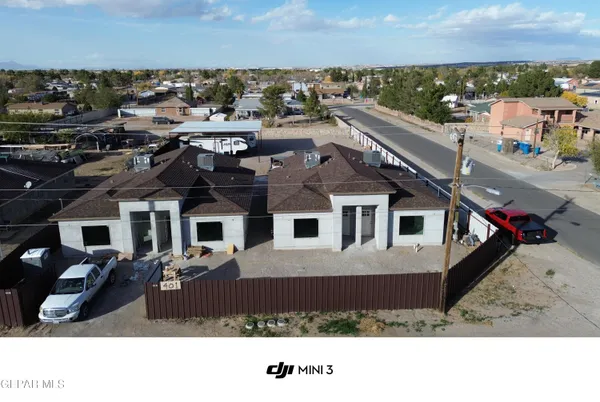 a aerial view of a house with a yard