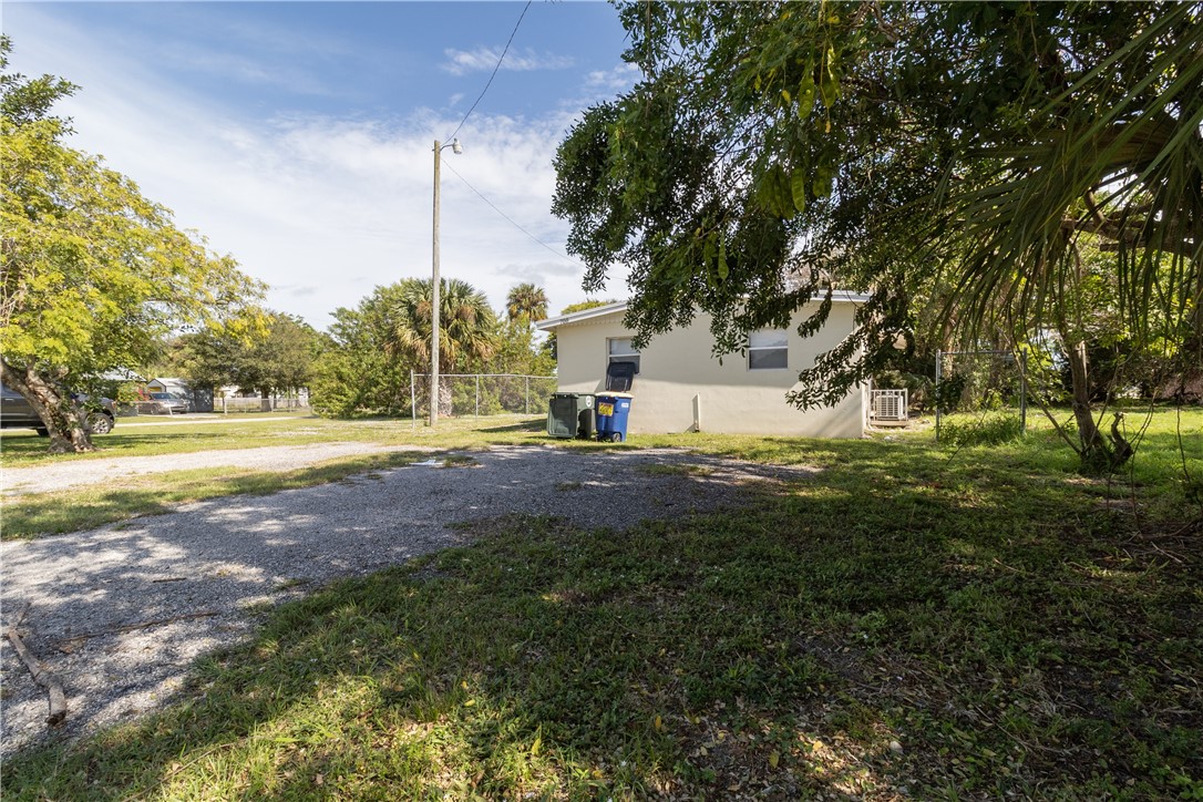 708 North 14th Street Fort Pierce, FL 34950 - Photo 11 of 12 a view of road with large trees