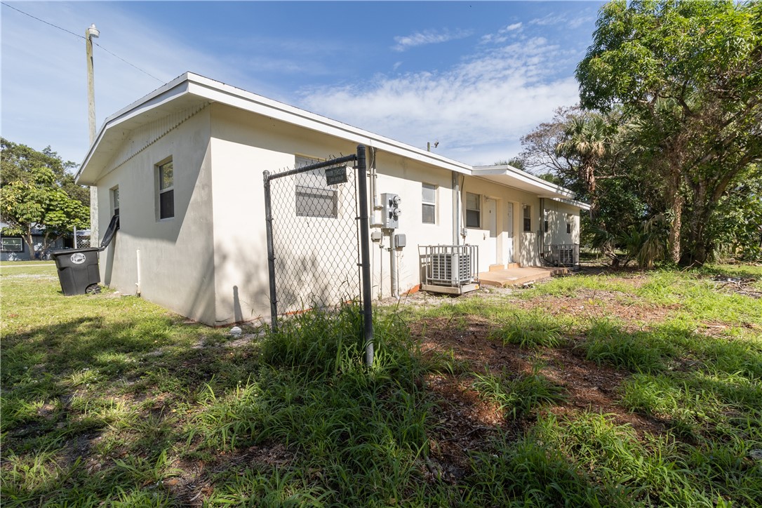 708 North 14th Street Fort Pierce, FL 34950 - Photo 12 of 12 a front view of a house with a yard