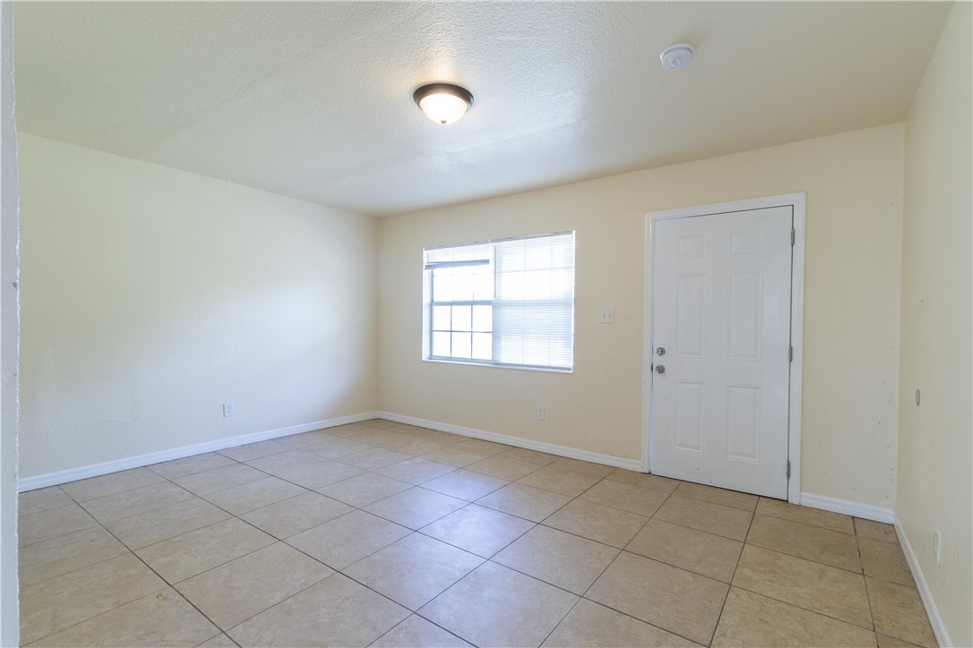 708 North 14th Street Fort Pierce, FL 34950 - Photo 3 of 12 an empty room with windows