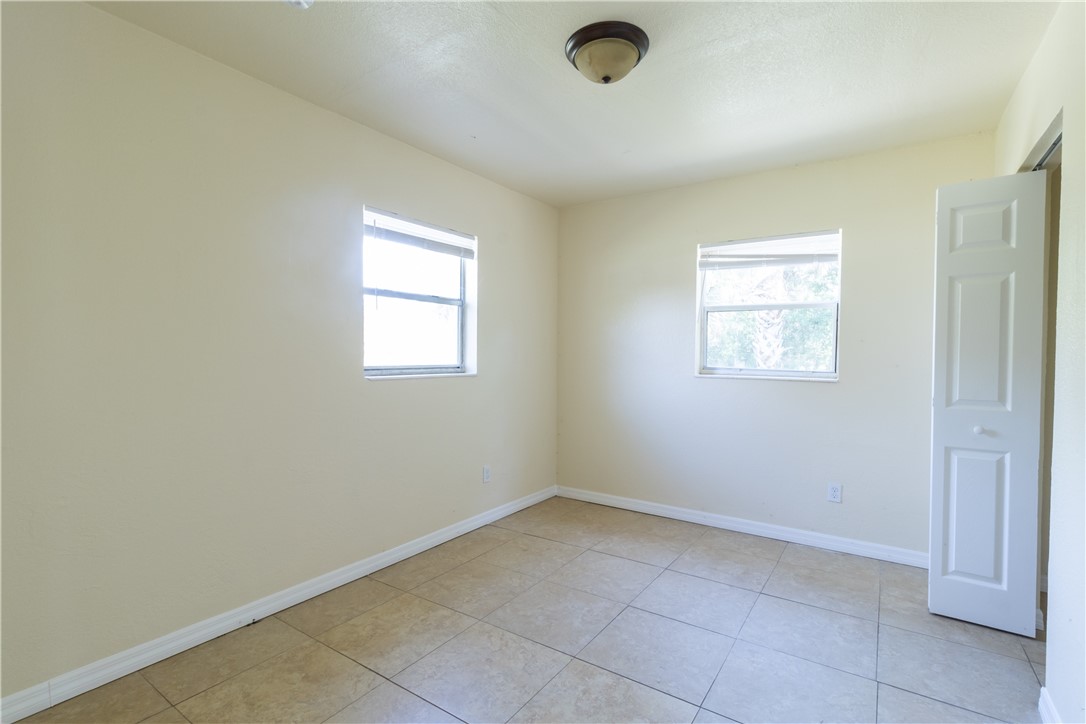 708 North 14th Street Fort Pierce, FL 34950 - Photo 9 of 12 an empty room with a window
