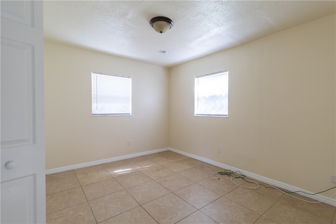 708 North 14th Street Fort Pierce, FL 34950 - Photo 10 of 12 an empty room with windows