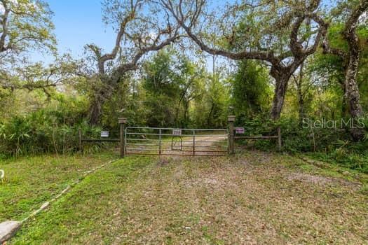 248 Bronco Road Zolfo Springs, FL 33890 - Photo 1 of 1 Front gate