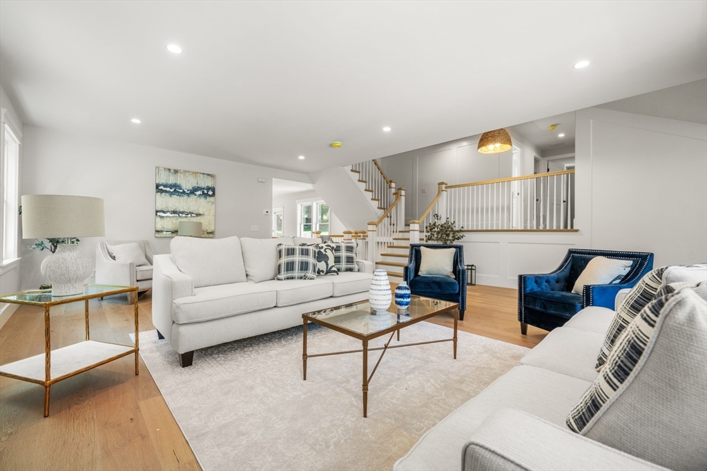 2 Rockwood Road Natick, MA 01760 - Photo 13 of 37 a living room with furniture and a potted plant